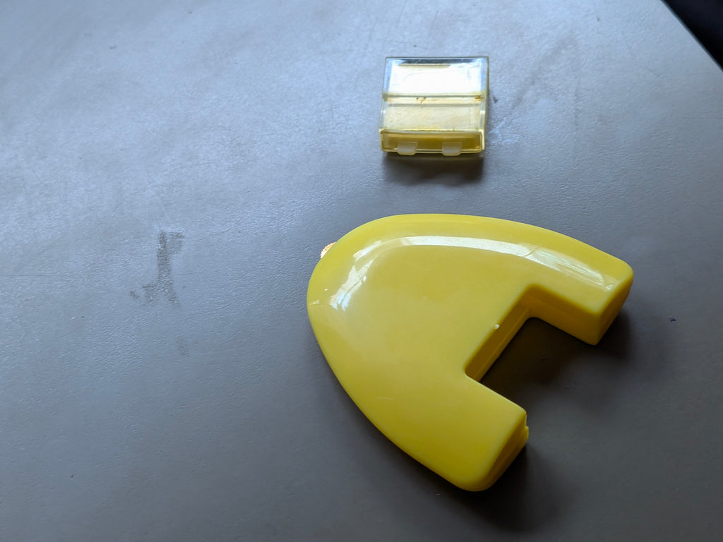 yellow wheel triangular chalk